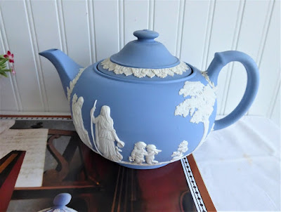 https://timewasantiques.net/collections/wedgwood/products/wedgwood-jasperware-teapot-1953-large-ceres-offering-to-peace-6-cups-blue-and-white