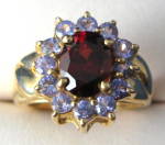 Gold Ring Genuine Oval Garnet Surrounded by Tanzanites